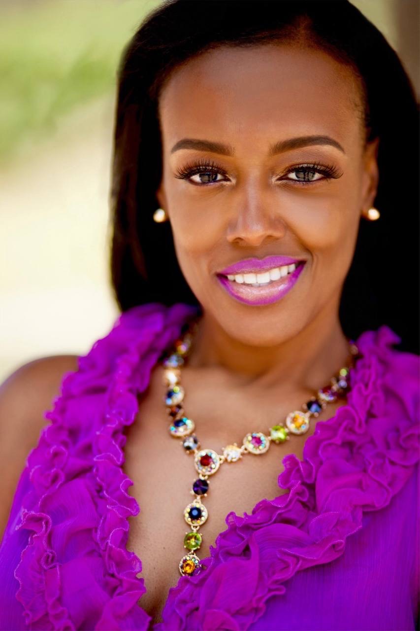 Smiling woman wearing a purple dress and elegant necklace. Smiling woman wearing a purple dress and elegant necklace.