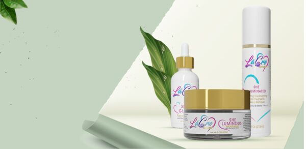 Skincare products with green leaves and soft lighting.