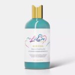 Aqua blue bottle with gold cap labeled 'Le Glow' skincare product.