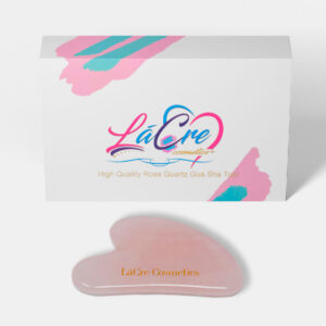 Pink silicone makeup applicator with branded packaging.