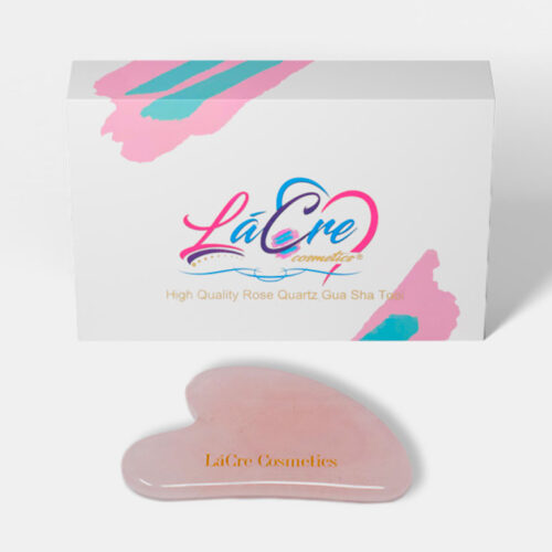 Pink silicone makeup applicator with branded packaging.