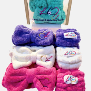 Colorful, fluffy headbands with embroidered logos, arranged neatly.