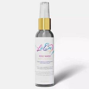 Elegant spray bottle with a gold cap and pastel label design.